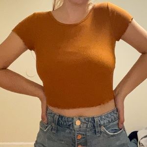 orange ripped lettuce trim crop top